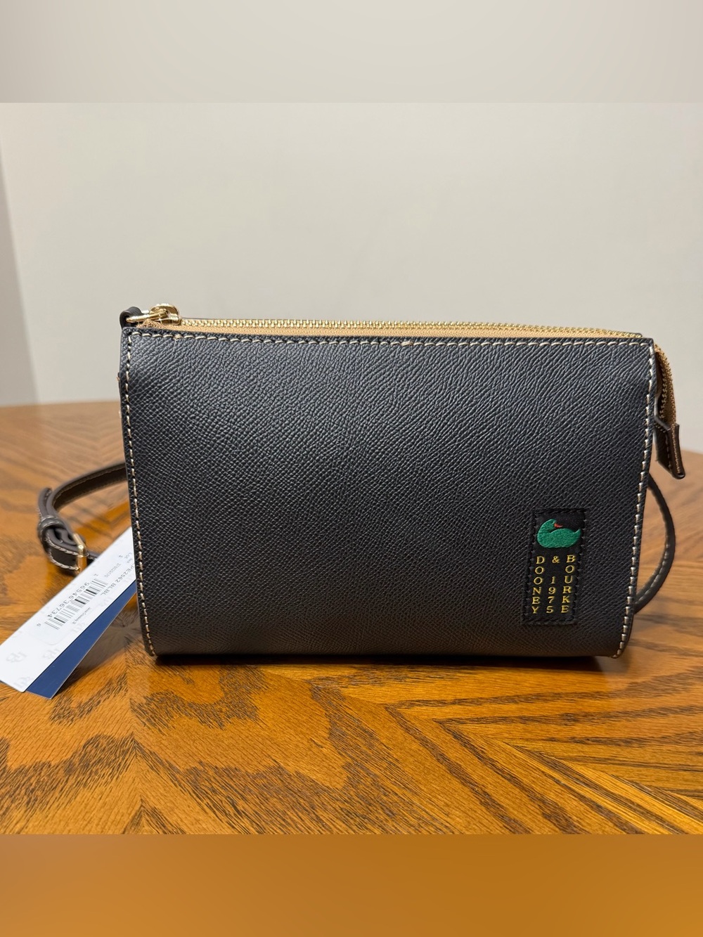Dooney & Bourke Black Zip Pouch with Green Logo Patch